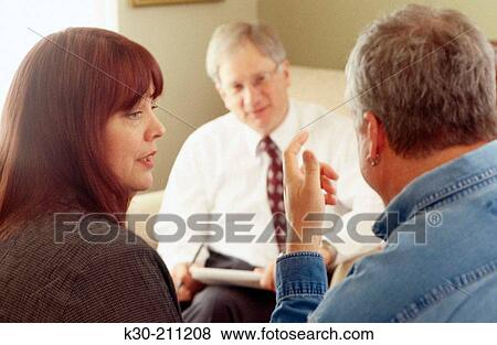 Therapist and Patients in a Counseling Session View Large Photo Image Stock Photo - Therapist and Patients in a Counseling Session. Fotosearch