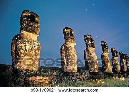 These? moais,? carved monoliths of ancestral gods, are believed to date from the 13th or 14th century Easter island lies 2, 100 miles off the coast of Chile in the Pacific Ocean View Large Photo Image Stock Image - These? moais,? carved monoliths of ancestral gods, are believed to date from the 13th or 14th century Easter island lies 2, 100 miles off the coast of Chile in the Pacific Ocean. Fotosearch