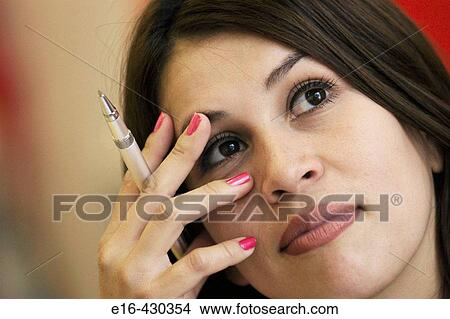 Thinking Hispanic woman View Large Photo Image Picture - Thinking Hispanic woman. Fotosearch
