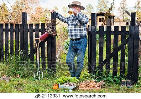 Thirsty man with glass of bear relaxing in the garden. View Large Photo Image Stock Image - Thirsty man with glass of bear relaxing in the garden.. Fotosearch