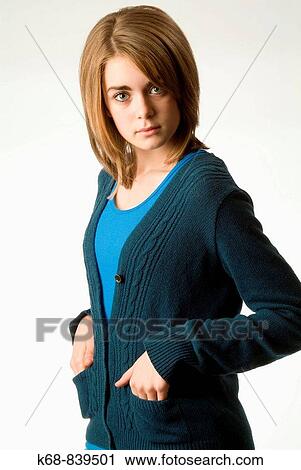 Stock Image - thirteen year old girl, in studio, white background. Fotosearch