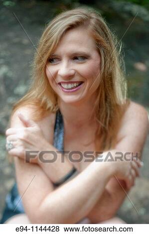 Thirty eight year old blond woman in casual clothes in outdoor setting View Large Photo Image Stock Photo - Thirty eight year old blond woman in casual clothes in outdoor setting. Fotosearch