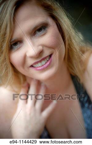 Thirty eight year old blond woman in casual clothes in outdoor setting View Large Photo Image Stock Photo - Thirty eight year old blond woman in casual clothes in outdoor setting. Fotosearch