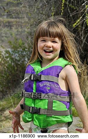 This cute 3 year old Caucasian girl is smiling and happy while playing outdoors She's wearing a green life vest and coverd in mud as she's been playing View Large Photo Image Stock Image - This cute 3 year old Caucasian girl is smiling and happy while playing outdoors She's wearing a green life vest and coverd in mud as she's been playing. Fotosearch