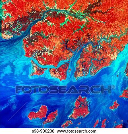 This Landsat 7 image of Guinea-Bissau, a small country in West Africa, shows the complex patterns of the country's shallow coastal waters, where silt carried by the Geba and other rivers washes out into the Atlantic Ocean View Large Photo Image Stock Photo - This Landsat 7 image of Guinea-Bissau, a small country in West Africa, shows the complex patterns of the country's shallow coastal waters, where silt carried by the Geba and other rivers washes out into the Atlantic Ocean. Fotosearch
