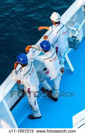 Thomson Destiny; men working on foredeck. View Large Photo Image Stock Photography - Thomson Destiny; men working on foredeck.. Fotosearch