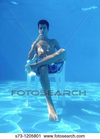 Stock Image - Thoughtful boy underwater. Fotosearch