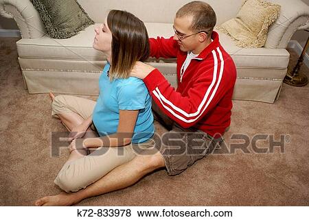 Thoughtful husband massages his pregnant wife's shoulders View Large Photo Image Stock Photo - Thoughtful husband massages his pregnant wife's shoulders. Fotosearch