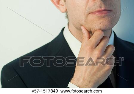 Thoughtful man, hand on chin. Close view. View Large Photo Image Stock Photo - Thoughtful man, hand on chin. Close view.. Fotosearch
