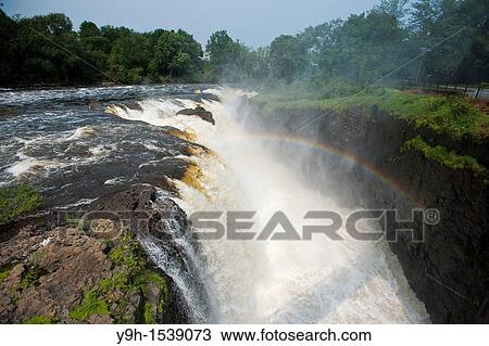 Thousands of gallons of water cascade over the Great Falls of the Passaic River in Paterson, NJ, seen on Saturday, September 3, 2011 View Large Photo Image Stock Image - Thousands of gallons of water cascade over the Great Falls of the Passaic River in Paterson, NJ, seen on Saturday, September 3, 2011. Fotosearch