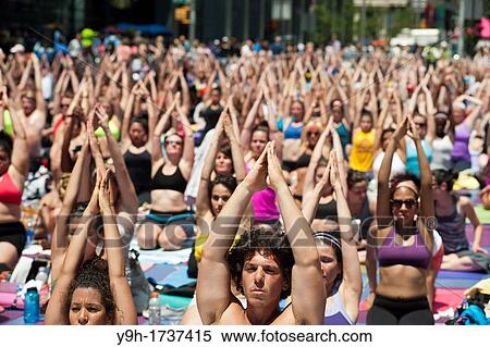 Thousands of yoga practitioners in Times Square in New York participate in a mid-day Bikram Yoga class on the first day of summer Temperatures are expected to rise into the upper 90's today as most New Yorkers seek relief from the heat View Large Photo Image Stock Photography - Thousands of yoga practitioners in Times Square in New York participate in a mid-day Bikram Yoga class on the first day of summer Temperatures are expected to rise into the upper 90's today as most New Yorkers seek relief from the heat. Fotosearch