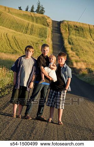 Three boys and their toddler sister on a road near Fairfield, Washington, in the Palouse. View Large Photo Image Stock Photo - Three boys and their toddler sister on a road near Fairfield, Washington, in the Palouse.. Fotosearch