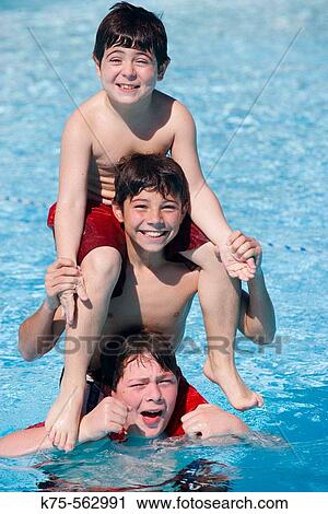 Three brothers piggyback in pool View Large Photo Image Stock Image - Three brothers piggyback in pool. Fotosearch
