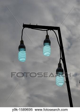 Three energy saving light bulbs outside View Large Photo Image Stock Photography - Three energy saving light bulbs outside. Fotosearch