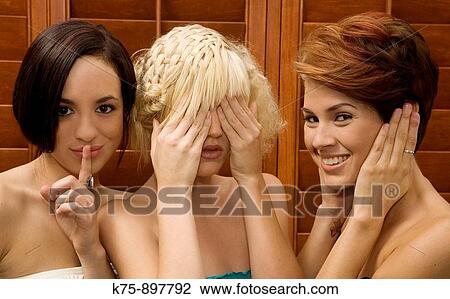 Stock Image - Three females speak, see, hear. Fotosearch