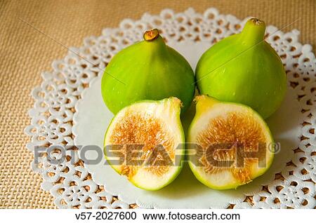 Three figs, one of them cut in two halves. Still life. View Large Photo Image Stock Image - Three figs, one of them cut in two halves. Still life.. Fotosearch