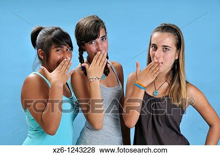 three friends are surprised, with blue backgroud View Large Photo Image Stock Photo - three friends are surprised, with blue backgroud. Fotosearch