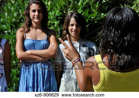 Stock Photo - three friends finger counting. Fotosearch