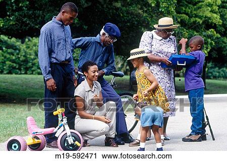 Three generation family gathering View Large Photo Image Stock Image - Three generation family gathering. Fotosearch