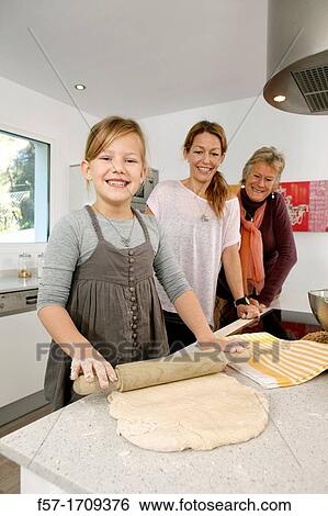 Three generations of women in the kitchen View Large Photo Image Stock Photograph - Three generations of women in the kitchen. Fotosearch