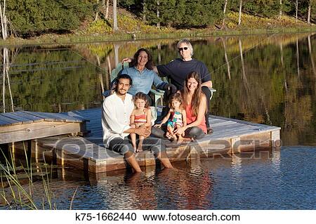 Three generations portrait on dock on lake View Large Photo Image Stock Image - Three generations portrait on dock on lake. Fotosearch