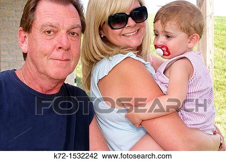 Stock Image - Three generations posing together. Fotosearch