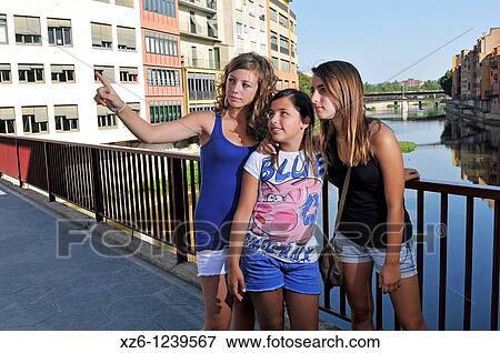 Three girls pointing, Girona, Catalonia, Spain, Europe View Large Photo Image Stock Photo - Three girls pointing, Girona, Catalonia, Spain, Europe. Fotosearch
