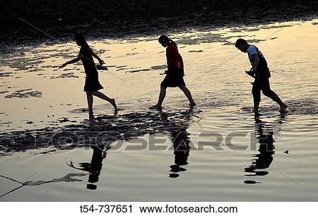 Three Lao People crossing part of Mekong River, Vientiane, Laos View Large Photo Image Stock Image - Three Lao People crossing part of Mekong River, Vientiane, Laos. Fotosearch