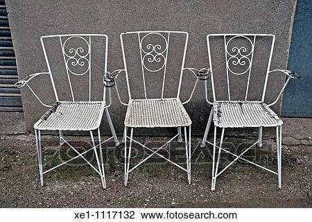 Three metal white chairs. View Large Photo Image Stock Image - Three metal white chairs.. Fotosearch