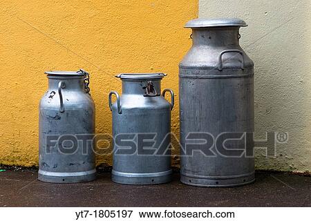 Stock Photo - Three milk churns in Dingle, County Kerry, Ireland. Fotosearch