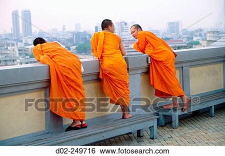 Three monks survey the city at the end of the day from the Golden Mount. Bangkok. Thailand View Large Photo Image Stock Photograph - Three monks survey the city at the end of the day from the Golden Mount. Bangkok. Thailand. Fotosearch