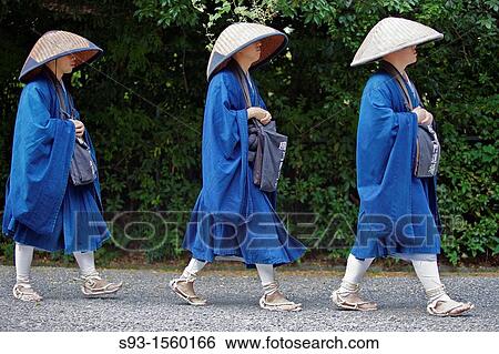Stock Photograph - Three monks walking in single file. Fotosearch