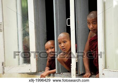 three novices looking out of a window, Burma View Large Photo Image Stock Photo - three novices looking out of a window, Burma. Fotosearch