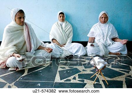 Three of the Jain sadhvis meditating in there room before having their lunch in Brindavan. This was shot after a 20 klm walk from Mysore to Brindavan. Karnataka View Large Photo Image Stock Image - Three of the Jain sadhvis meditating in there room before having their lunch in Brindavan. This was shot after a 20 klm walk from Mysore to Brindavan. Karnataka. Fotosearch