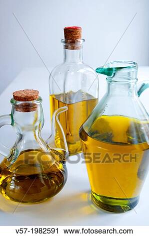 Stock Image - Three oil bottles. Close view.. Fotosearch