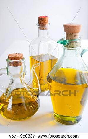 Three oil bottles. Close view. View Large Photo Image Stock Photo - Three oil bottles. Close view.. Fotosearch