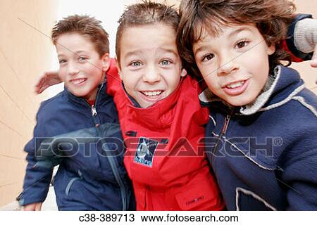 Stock Image - Three Schoolboys Playing. Fotosearch