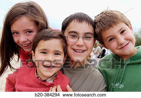 Picture - Three, seven and ten years old children.. Fotosearch