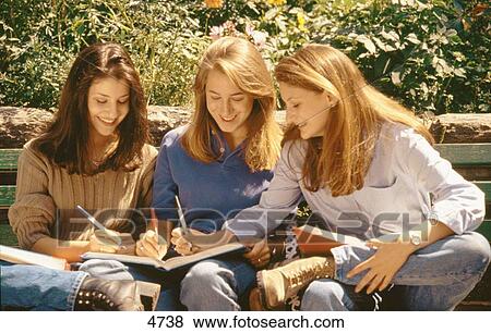 Three teen girls study View Large Photo Image Stock Photo - Three teen girls study. Fotosearch