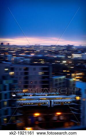 Three trains at dusk, London, UK View Large Photo Image Stock Image - Three trains at dusk, London, UK. Fotosearch