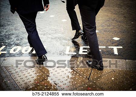 Three unrecognizable executive trying to cross the street in London, England, UK, Europe View Large Photo Image Stock Photography - Three unrecognizable executive trying to cross the street in London, England, UK, Europe. Fotosearch