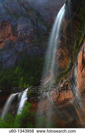 Three waterfalls are produced during a heavy rain at The Emerald Pools at zion National Park, Utah View Large Photo Image Stock Photo - Three waterfalls are produced during a heavy rain at The Emerald Pools at zion National Park, Utah. Fotosearch