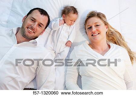 Three week old baby boy with parents. View Large Photo Image Stock Image - Three week old baby boy with parents.. Fotosearch