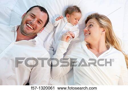 Three week old baby boy with parents. View Large Photo Image Stock Image - Three week old baby boy with parents.. Fotosearch