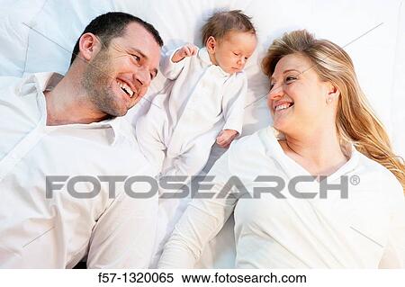 Three week old baby boy with parents. View Large Photo Image Stock Photography - Three week old baby boy with parents.. Fotosearch