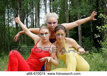 Picture - Three women perforrming outdoor. Fotosearch