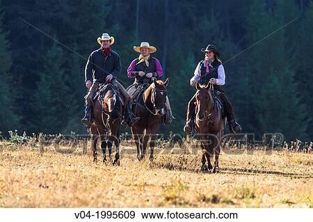 Three wranglers cowboys on horse, Montana, USA View Large Photo Image Stock Photo - Three wranglers cowboys on horse, Montana, USA. Fotosearch