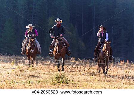 Three wranglers cowboys on horse, Montana, USA View Large Photo Image Stock Photo - Three wranglers cowboys on horse, Montana, USA. Fotosearch