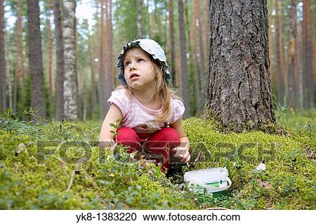 Stock Image - Three Year Old Berry-Picker Girl in Forest. Fotosearch
