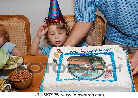 Three year old boy at this birthday party View Large Photo Image Stock Photography - Three year old boy at this birthday party. Fotosearch